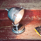 A glass vehicle headlight for a single lamp.