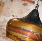 The metal is marbled, oscillating between brass and copper.