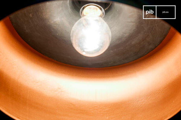 The interior is copper plated, which allows a warm light to be diffused.