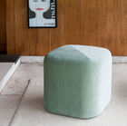 The pretty green velvet pouf changes colour with the brightness.