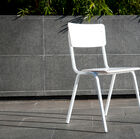White chair with sleek lines.