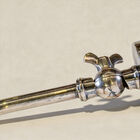 This desk lamp is built around a nickel-plated brass structure with a brushed finish