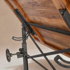 It rests on a heavy cast steel base equipped with a rack and pinion system