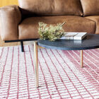 Attractive round coffee table in black marble with a gilded base.