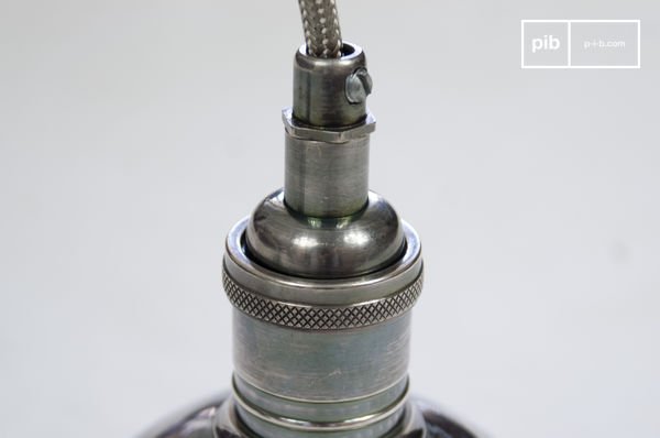 Base, visible screw and cable coated with a metal braid.