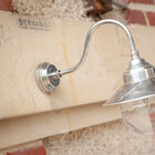 The small silvery Swan neck wall light is an ideal light to highlight your exterior