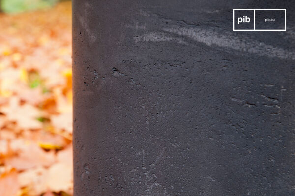 This table with its rough and austere appearance would look good indoors or outside