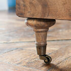 The sofa is installed on pretty little wheels.