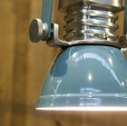 The lampshade is a pretty blue-grey varnished and shiny.