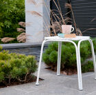 The metal stool has a beautiful matt white colour.