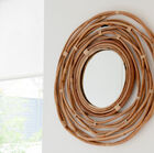 Stupendo specchio rotondo in rattan naturale.