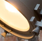 The visible screws reinforce the retro loft feel.