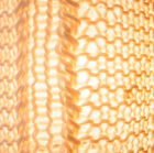 Le tricot blanc confère à la lampe des accents nordiques.