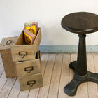 The base is massive, and elegantly combines with the dark wood of the seat.