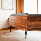 The backrest is used to support furniture or to delimit rooms.