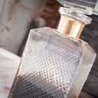 The carafe has a beautiful gold brass ring.