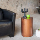 A small metal table with a timeless look.