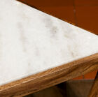 A nice contrast between marble and dark wood.