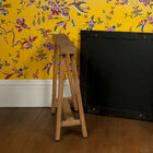 This table trestle is a practical little piece of furniture that proudly displays its noble wooden