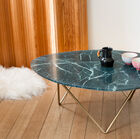 The green marble top rests on a gilded geometric base.