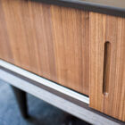 The matte brown coloured finish makes for a beautiful contrast with the oak panels which act as