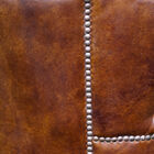 A solid beech structure covered with a pretty full grain leather.