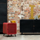 1950s buffet accompanied by a red bedside table.