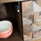 Dozens of wooden triangles were assembled by hand.