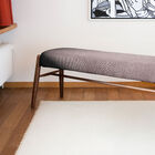 Entirely made out of solid walnut wood and with its grey seat, the Larsson bench is very robust
