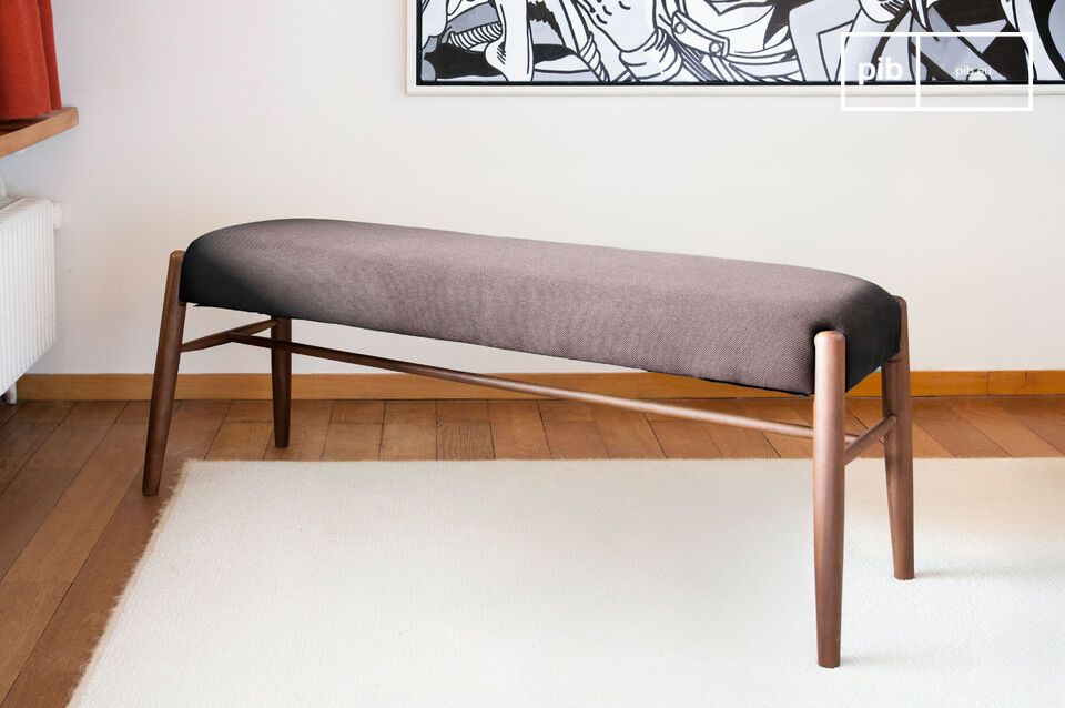Entirely made out of solid walnut wood and with its grey seat, the Larsson bench is very robust
