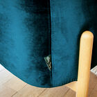 The chair is based on a light wooden structure.