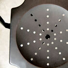 The chair has a very dark grey varnished finish.