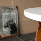 The W coffee table displays a particularly nice line with its feet made of solid wood