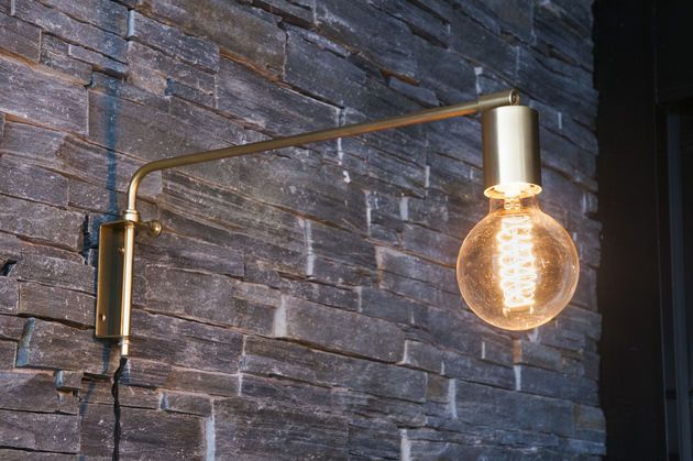 Adjustable gold metal wall lamp Janika