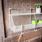 Nice white metal wall storage, with various storage spaces.