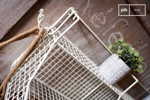 The shelf has different hooks located on the front and side.