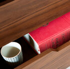 The drawers have pretty openwork handles.