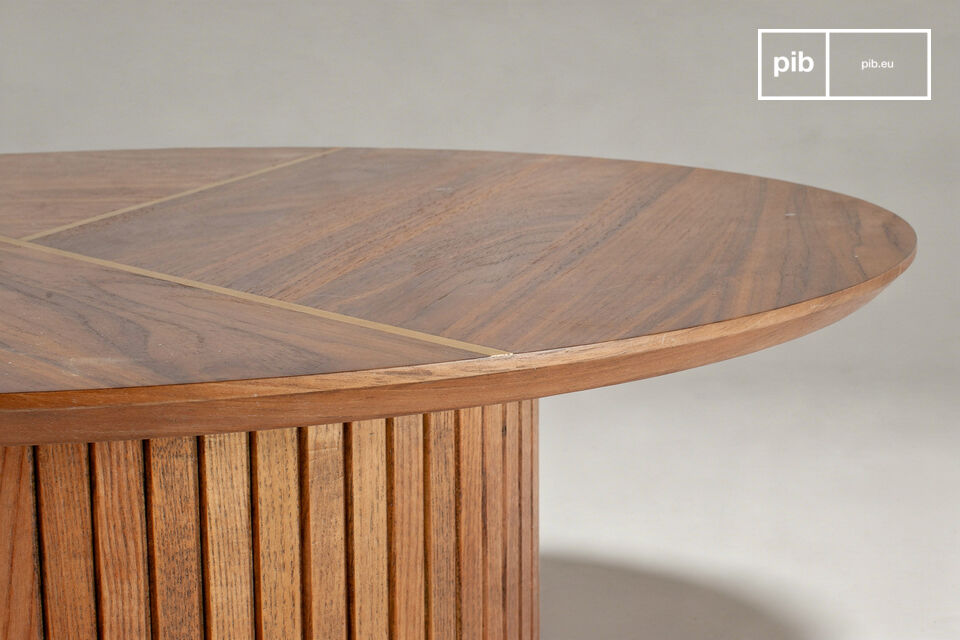 The deep walnut veneer, with its organic patterns, is split by two precisely inlaid brass lines