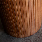 The beveled edges create an airy effect, softening the silhouette and inviting conviviality