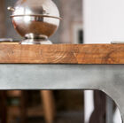 A beautiful combination of dark wood and the grey colour of the foot.