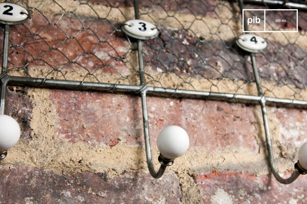 Hooks numbered by ceramic numerals.