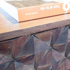 The drawer is made of hand-assembled wooden triangles.