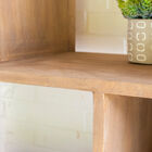 The furniture is made of solid wood with a slight patina.