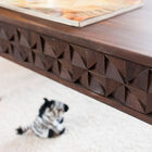 The side is composed of hand-assembled wooden triangles.