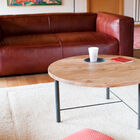 Beautiful round coffee table in wood and metal.