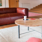 In the middle of the table, a grey inlaid disc, like the base.