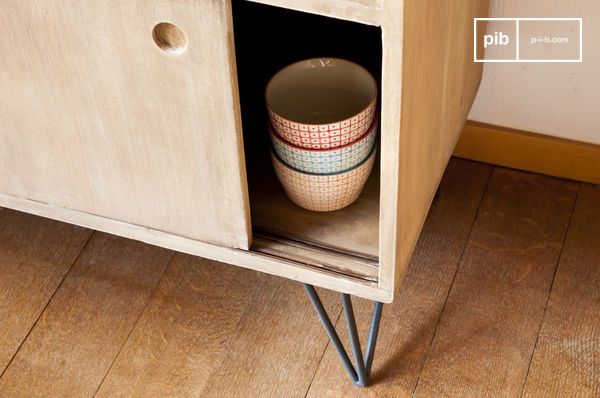 Contrasting dark metal legs with the light wood