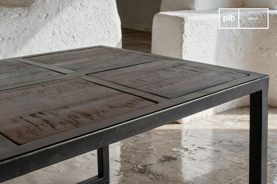 Deze salontafel heeft een monochrome geometrische structuur waarbij het metaal de organische